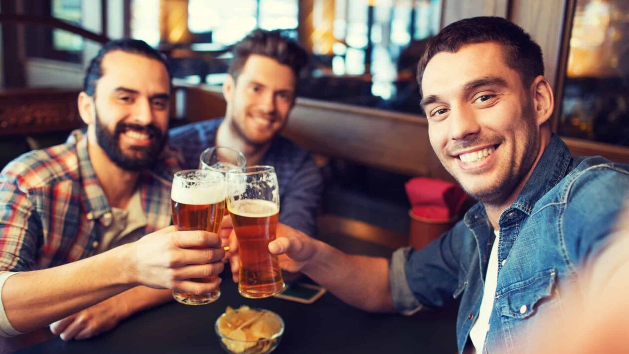 a man drinking with friends